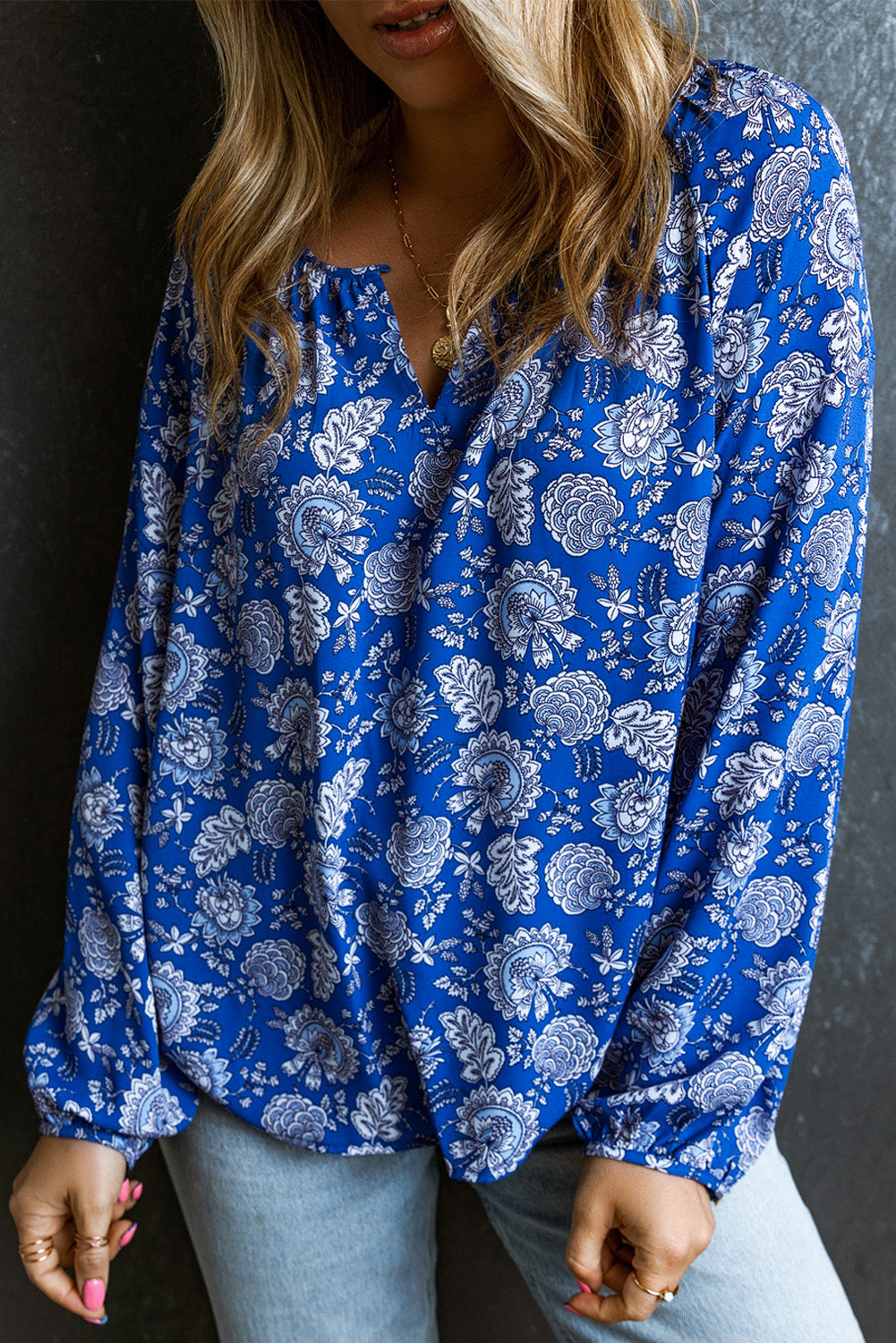 Blouse met ballonmouwen en bloemenprint en inkepingen in de hals