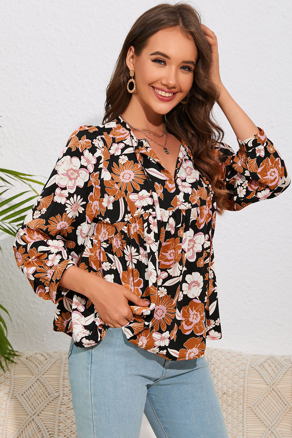 Babydoll-blouse met bloemenstrik